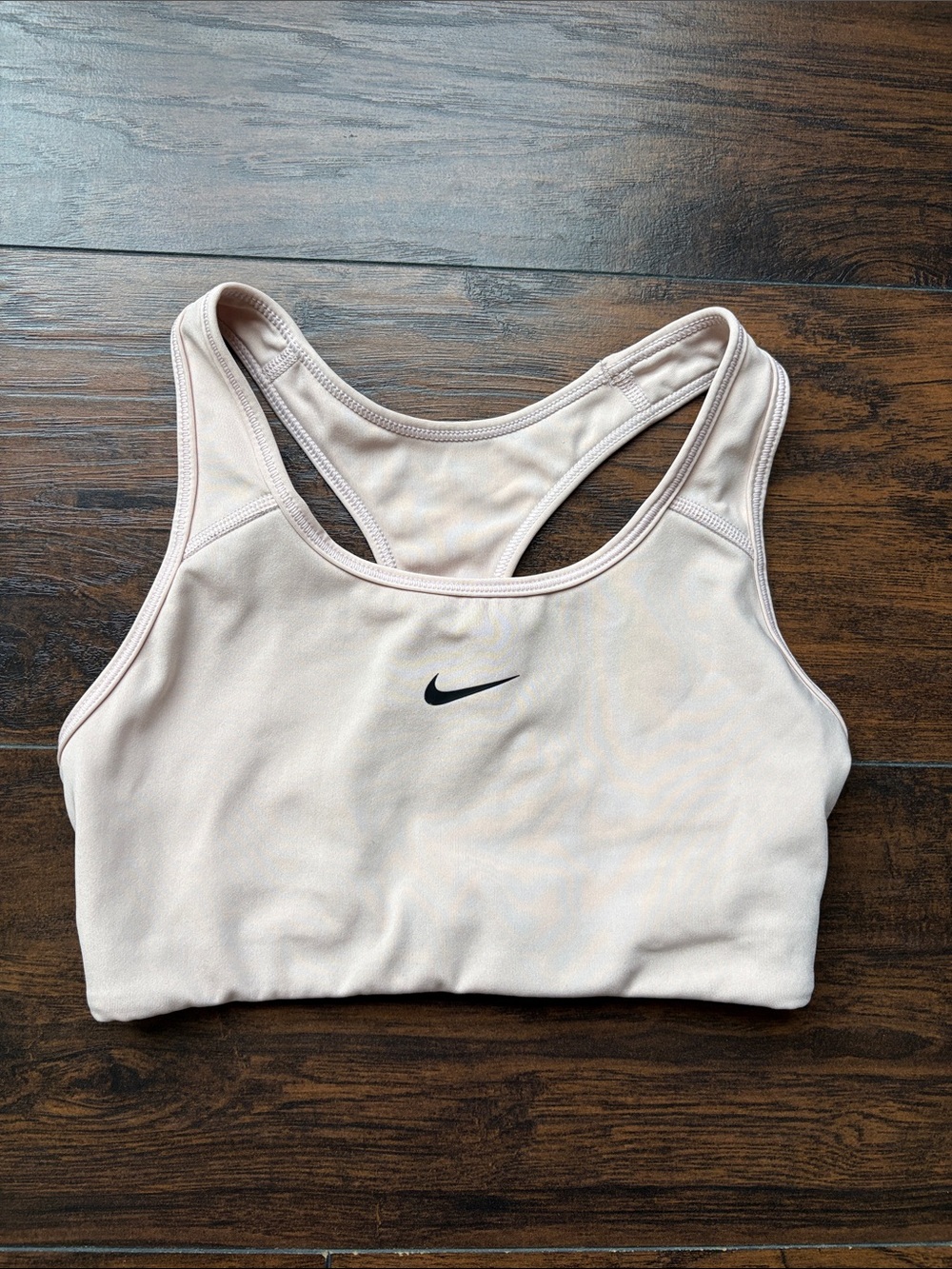 Nike Women’s light beige Racerback Sports Bra with Black Swoosh